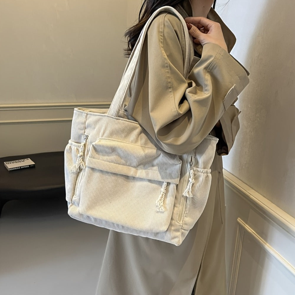 Spacious And Trendy Shoulder Bag for Women, Crafted from Corduroy Fabric. an Essential Addition to Your Wardrobe, It Includes Small Inner Pockets, a Zipper Closure, a Chic Minimalist Design for Underarm Wear, And Elastic Side Pockets