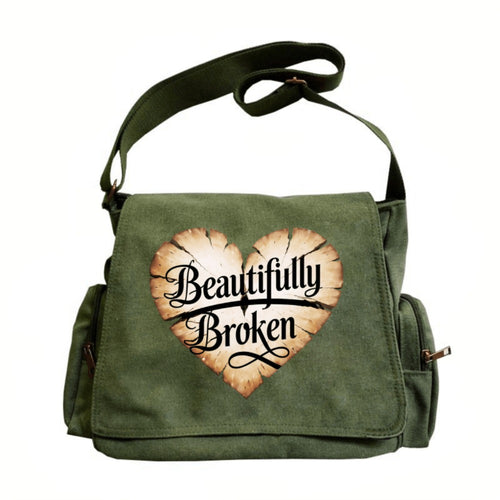 A Spacious Ladies' Shoulder Bag with a Flip-Top Design, Featuring a Vintage Style And a Heart-Shaped Crack Pattern Adorned with The Phrase 'Beautifully Broken'. It'S Perfect for Everyday Use And Travel