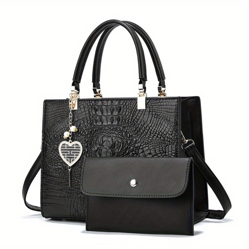 A Women'S Bag Featuring a Crocodile Print Texture, Designed for Both Hand And Crossbody Use, with a Heart-Shaped Hanging Decoration As a Finishing Touch