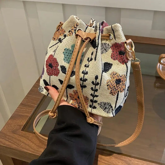 Elegant Floral Pattern Bucket Bag for Ladies: A handbag with ethnic style, featuring a zipper closure. It is suitable for both traveling and working, and can be used as a crossbody bag for outdoor leisure and commuting.