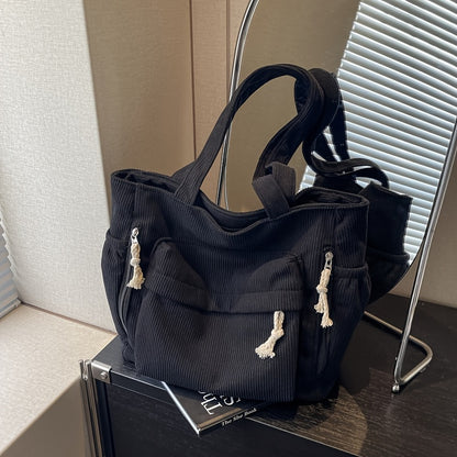Spacious And Trendy Shoulder Bag for Women, Crafted from Corduroy Fabric. an Essential Addition to Your Wardrobe, It Includes Small Inner Pockets, a Zipper Closure, a Chic Minimalist Design for Underarm Wear, And Elastic Side Pockets