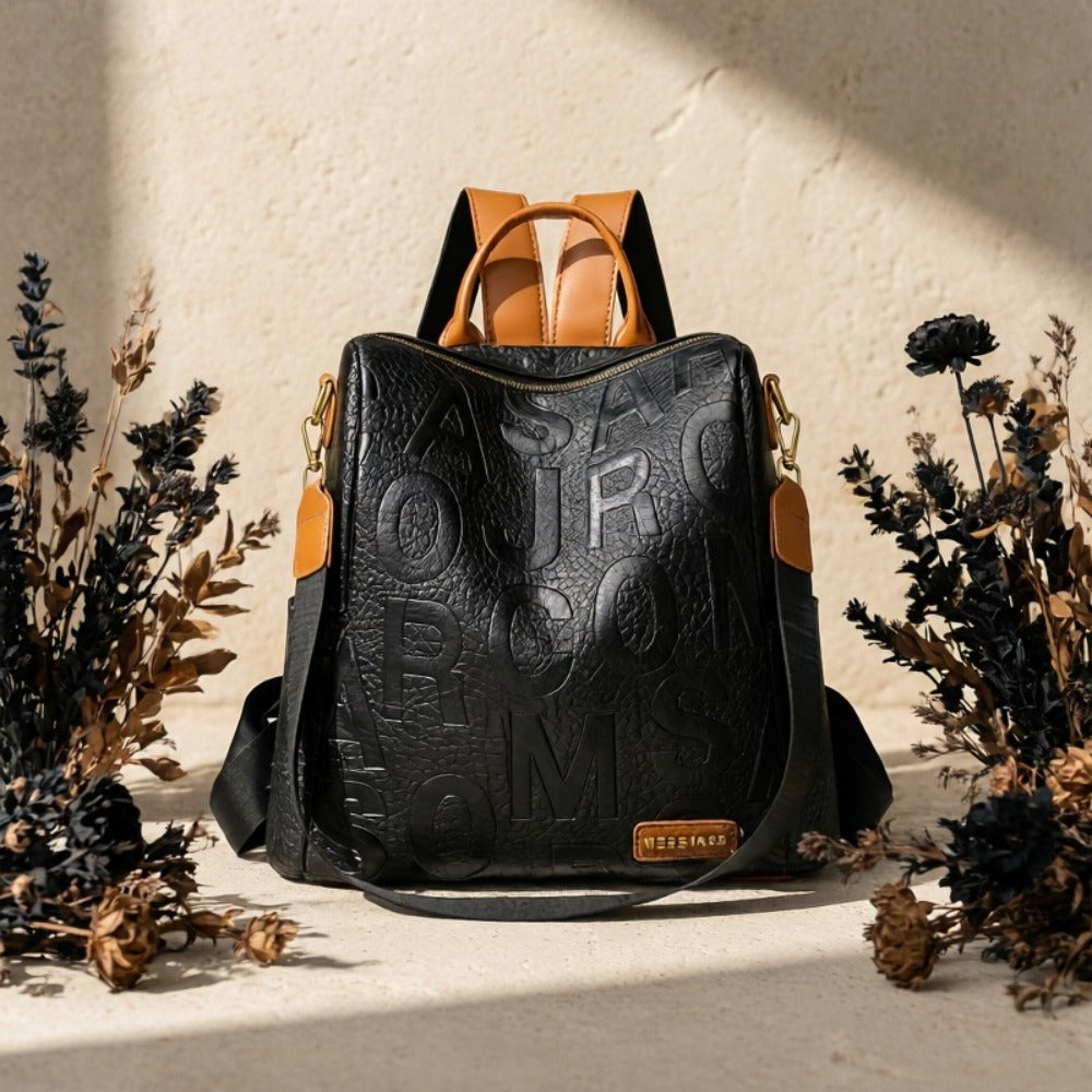 A Stylish And Modern Backpack for Women Featuring a Solid Color with Embossed Letters, a Classic Crocodile Pattern, And Golden Hardware Accents. It'S Lightweight with an Adjustable Shoulder Strap, Making It Ideal for Commuting, Leisure, Or Travel