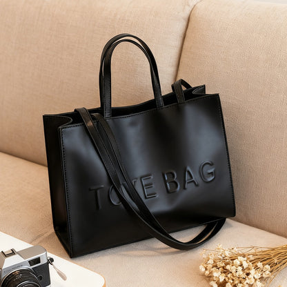 RAGSTO Women's Fashion Large Black Tote Bag, Embossed with "TOTE BAG" Lettering, High-Capacity Women's Shoulder/Underarm Bag, Work Bag, Lightweight and Durable Crossbody Handbag, Fixed Shoulder Strap, Ideal for Travel, Shopping, and Work