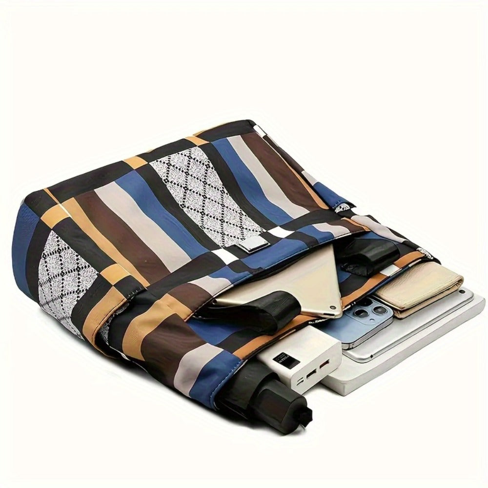 A Geometric Design Tote Bag Made of Lightweight Nylon with a Zipper, It Is Foldable And Versatile, Offering Ample Space for School, Work, Or Travel