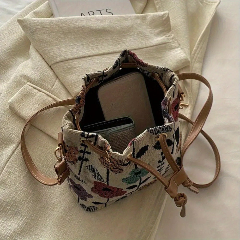 Elegant Floral Pattern Bucket Bag for Ladies: A handbag with ethnic style, featuring a zipper closure. It is suitable for both traveling and working, and can be used as a crossbody bag for outdoor leisure and commuting.
