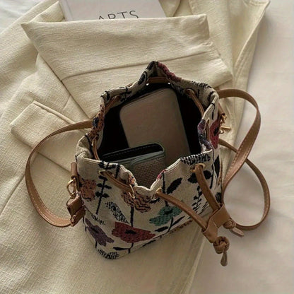 Elegant Floral Pattern Bucket Bag for Ladies: A handbag with ethnic style, featuring a zipper closure. It is suitable for both traveling and working, and can be used as a crossbody bag for outdoor leisure and commuting.