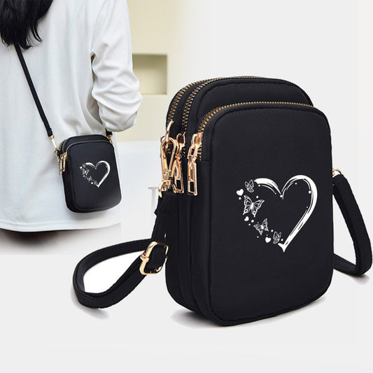 's Compact Crossbody Bag - Heart-Shaped Window with Golden Zipper, Adjustable Strap, Oxford Cloth Purse with Coin Pocket & Headphone Jack - Lightweight Everyday Bag for, Phone Purse for Travel, Work, School - Black Crossbody Bag with Butterfly Heart Print